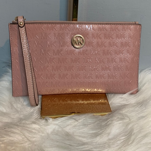 Authentic soft pink patent leather large wristlet clutch by Michael Kors